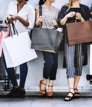 Female friends out shopping together